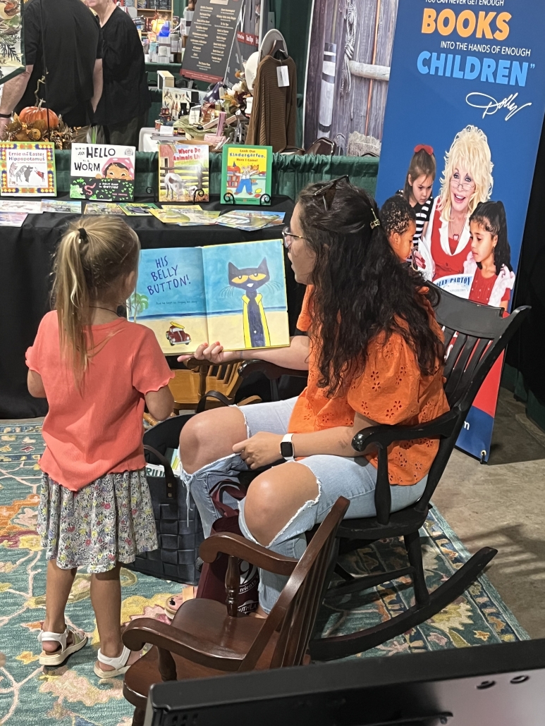 DPIL Fair 4 parent reading to child