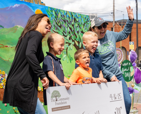 nonprofit director accepting a check from Great Community Give