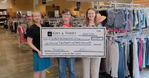 Lauren, Sue, Kelsey with Gift and Thrift check